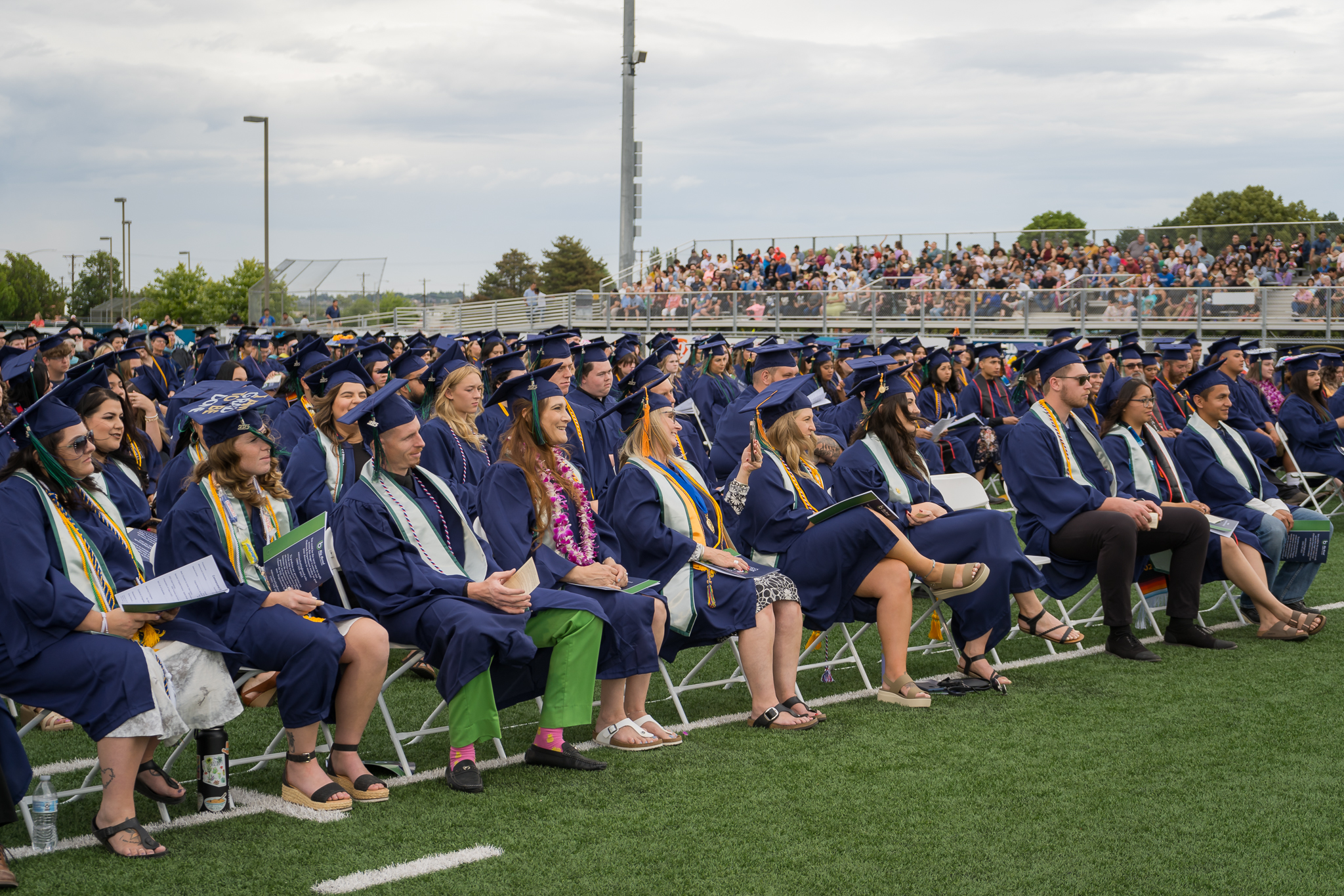 Members of the Class of 2023 listen to the graduation speakers during the event.