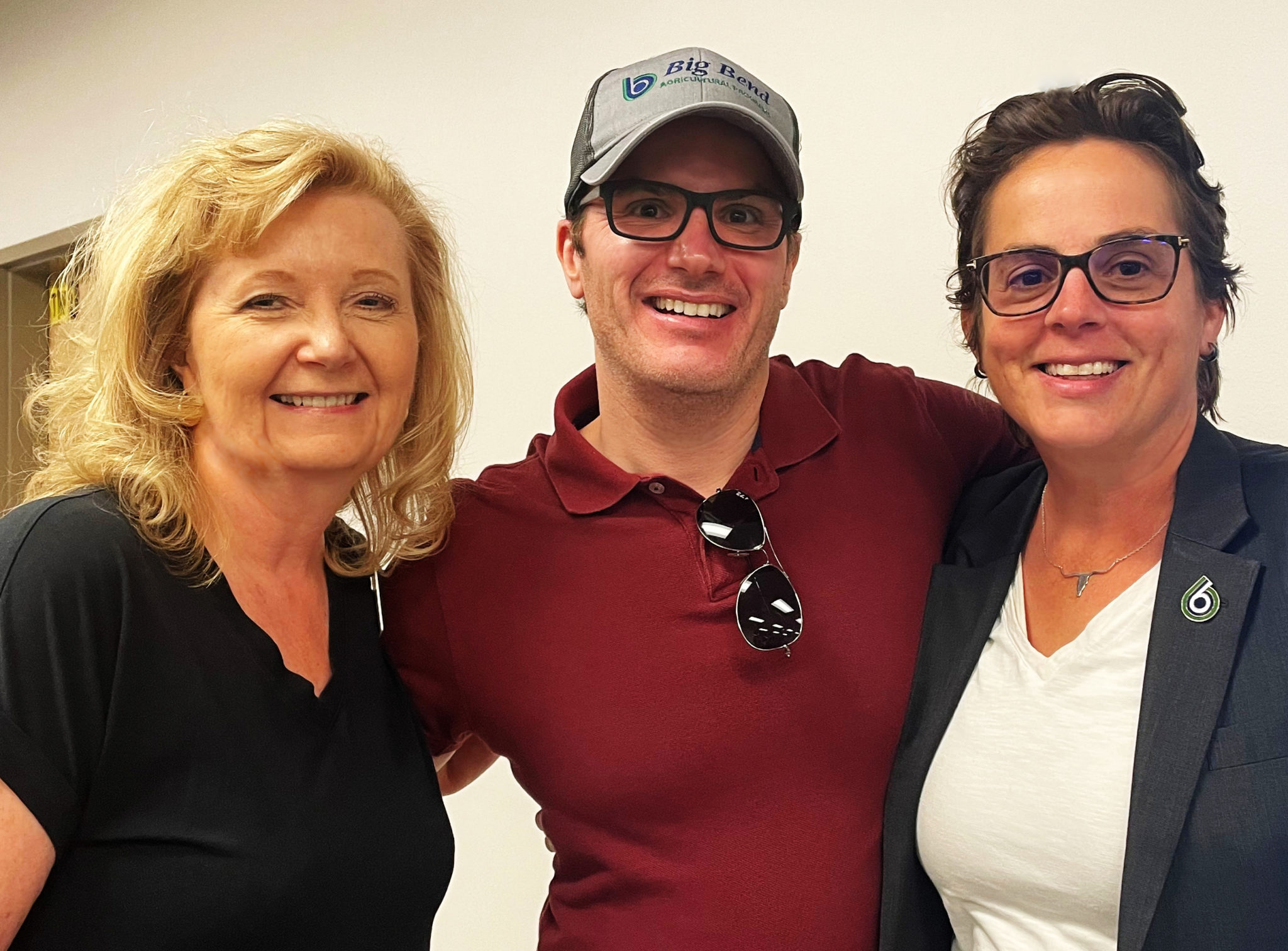 From left to right, LeAnne Parton, BBCC Foundation Executive Director, Dr. Aaron Mahoney, Agriculture and Chemistry Faculty, and Dr. Sara Thompson Tweedy, pose for a photo after finding out Big Bend was the recipient of a $300,000 grant from the Lauzier Foundation for a new Greenhouse Learning Center.